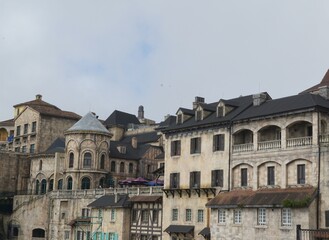 Fototapeta premium A row of old buildings with arched windows and balconies