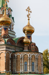 Obraz premium The Orthodox church has a golden cross on the roof of the building