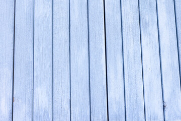 Obraz premium arrière plan texturé constitué de vieilles planches de bois, recouvertes de peinture bleue écaillée. Gros plan sur des portes, volets ou palissade