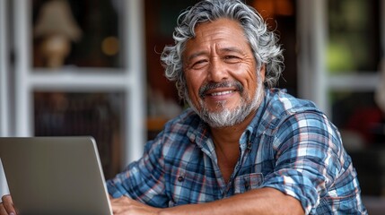 Obraz premium Happy old latin american man with laptop image. Working online. Small business development photography scene wallpaper. Mature hispanic male entrepreneur concept photorealistic photo