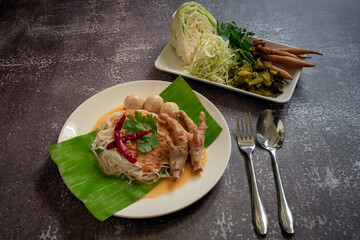 Thai Rice Noodles in Fish & Anchovy Curry Sauce. Kanom Cheen Num Ya (Fresh Thai rice noodle and a fish based sauce)
