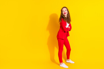 Full body portrait of gorgeous young lady folded hands look empty space wear red suit isolated on...