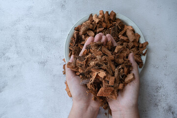 Chopped coconut or coconut husk chips texture and background. Coconut fluff for for planting trees or vegetables.