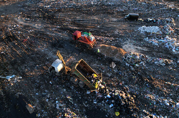 Landfill garbage truck. Garbage truck unloads rubbish in landfill. Landfill waste disposal. Garbage...