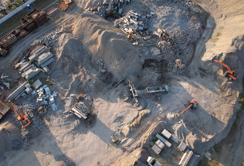 Recycling concrete and asphalt from demolition. Excavator at landfill load concrete waste. Disposal of Construction waste (CDW). Re-use concrete after demolition. Stone crushing site. recycled asphalt