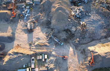 Recycling concrete and asphalt from demolition. Excavator at landfill load concrete waste. Disposal of Construction waste (CDW). Re-use concrete after demolition. Stone crushing site. recycled asphalt