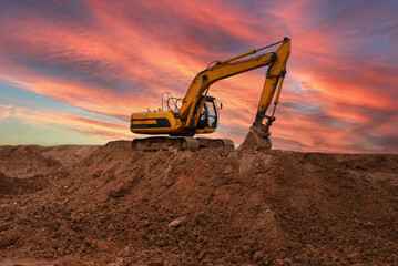 Excavator during earthmoving at construction site. Backhoe dig ground for the construction of...