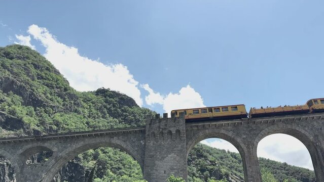 The yellow train (Le Petit Train Jaune) en route in Occitanie, Pyr&eacute;n&eacute;es Orientales.