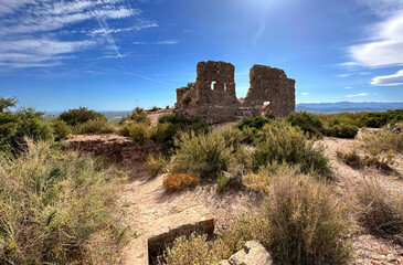 Ruins of Castillo De Almenara (Castell d'Almenara). Fortress ruins in mountains. Ruined fort on top of a mountain.