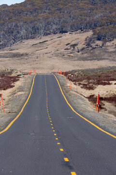 Snowy Mountains Highway, an alpine road with yellow road markings and orange snow guides