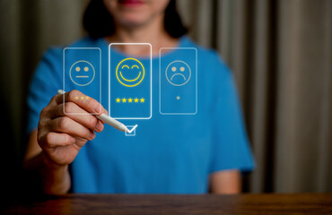 Woman hand writing on virtual screen to give five star symbol to increase rating of products and service, Customer service and business satisfaction survey.