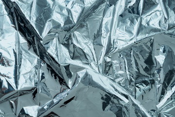 Shiny metal silver foil crumpled texture background