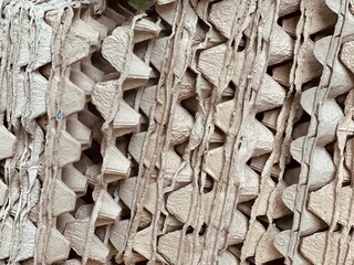 texture. Close-up photo of the eggs paper tray stacked upright in row.