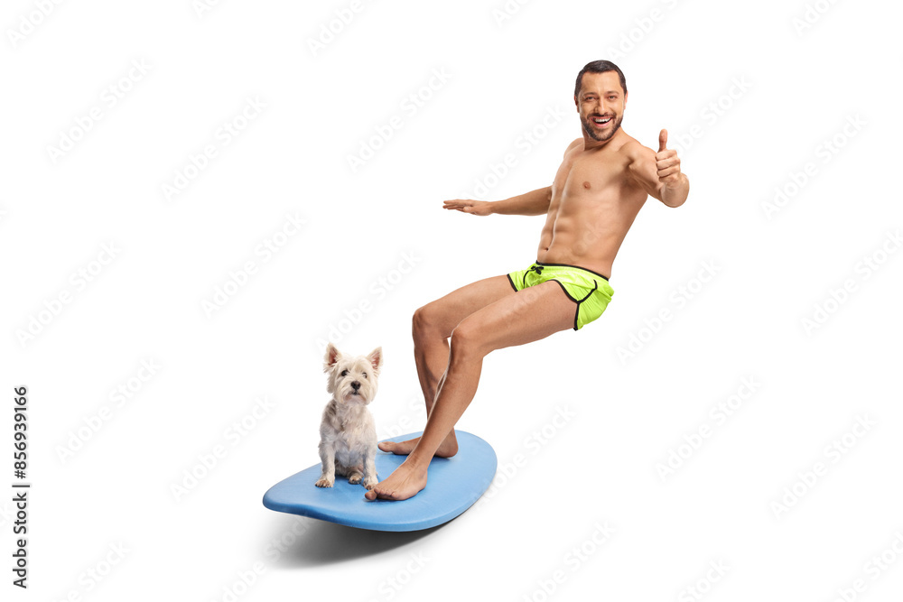 Poster full length shot of a surfer with a dog on a board smiling at camera and showing thumbs up