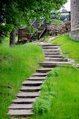 Happy Child, boy, running and jumpring on path in park with trees
