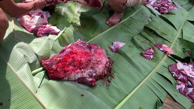 butcher cut the beef meat on sacrifice day eid-al-adha