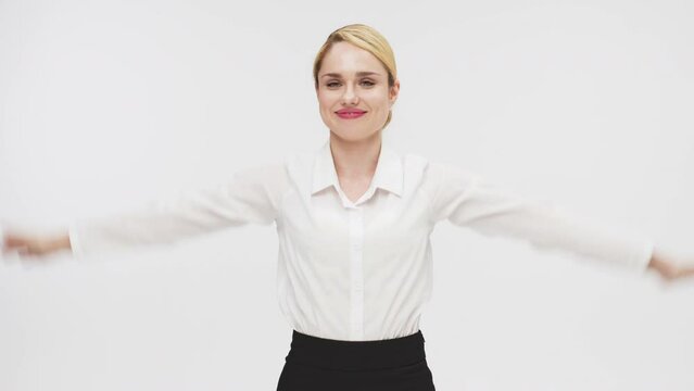 Successful business lady rejoices and enjoys cash dolor notes on a white studio background. Concept for successful business, credit and financial services.