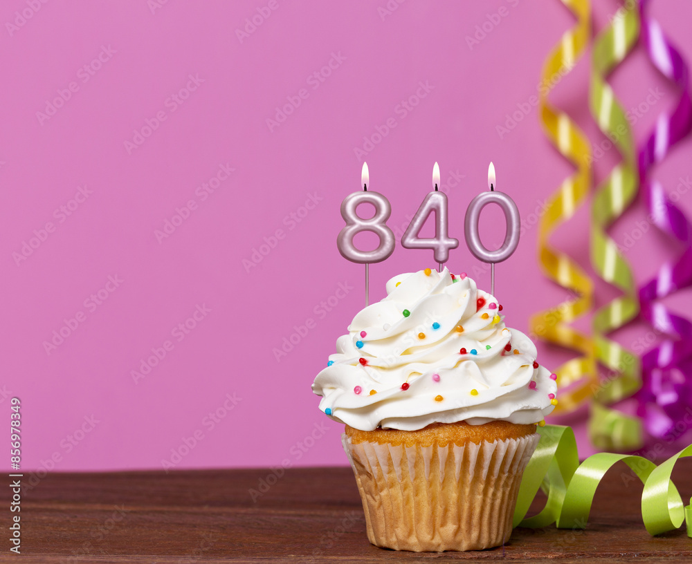 Wall mural birthday cupcake with candles lit forming the number 840