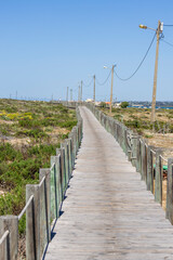 Faro, Portugal. 23-04-2024.Wooden path on the sand near the town of Faro. Algarve, Portugal.