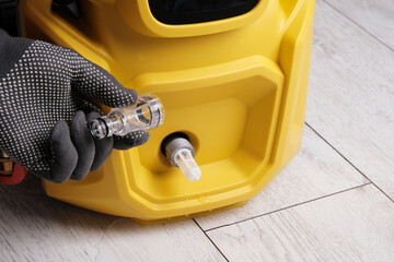 Cleaning the filter on a pressure washer close-up