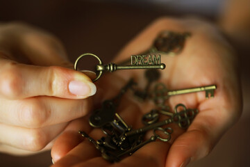 Close-up of Hands Holding a Key with 