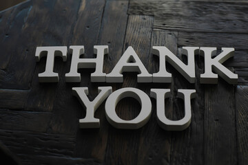 3D Thank You Letters on Dark Wooden Background - Gratitude and Appreciation Concept in Modern Design