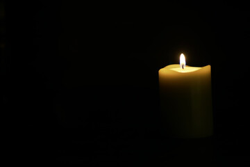 Single Lit Candle in Dark Room - Symbol of Hope, Solitude, and Peaceful Reflection