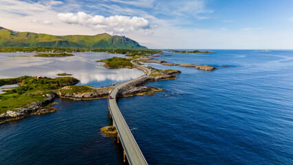 An aerial view of a bridge winding through a picturesque fjord in Norway, showcasing the stunning natural beauty of the region. Atlantic Ocean Road Norway © Fokke Baarssen