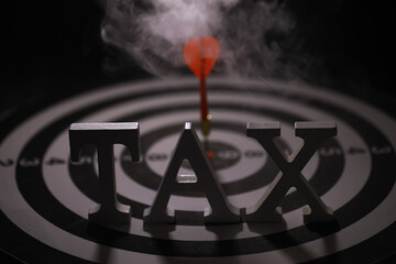 Tax Concept with Smoke on Target Background Symbolizing Financial Planning and Focus