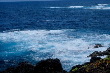 waves crashing on rocks