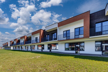 modern low-rise residential townhouse or public buildings complex with several multi-level apartments with isolated entrances