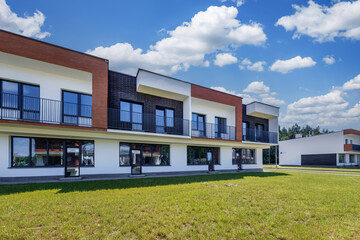 modern low-rise residential townhouse or public buildings complex with several multi-level apartments with isolated entrances