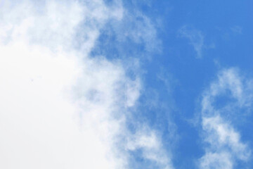 Obraz premium White passenger airplane flying in the sky amazing clouds in the background