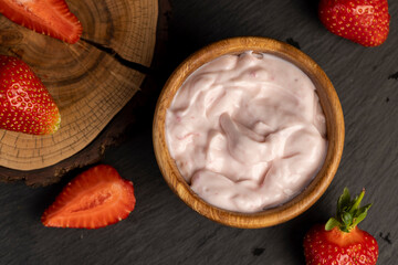 yogurt made from milk with added flavor and pieces of ripe strawberries