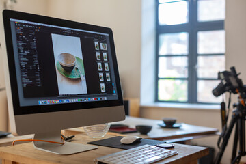 Food photography production set showing computer, keyboard, camera and tripod