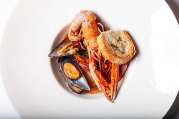 main course soup fish with mussel prawns, crostini and mussels