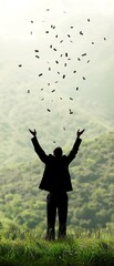 Silhouette of a person joyfully releasing leaves into the air against a scenic hill backdrop, symbolizing freedom and nature.