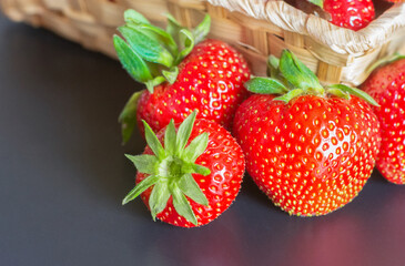 ripe strawberries in a basket on the table. High quality photo
