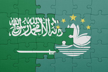 puzzle with the colourful national flag of Macau and flag of saudi arabia.