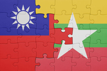 puzzle with the colourful national flag of myanmar and flag of taiwan .