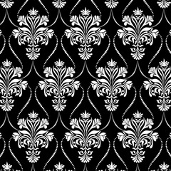 Black background with white ornament.Vector seamless pattern of white ornament on a black background.Template for carpets, wallpapers, textiles and any surface.