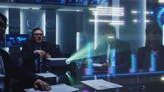 Business Professionals in a Meeting Room Analyze Financial Data Holograph Projected on Screen. Diverse Team Collaborates on Strategic Planning Using Digital Analytics, Charts, Graphis, Growth Visuals