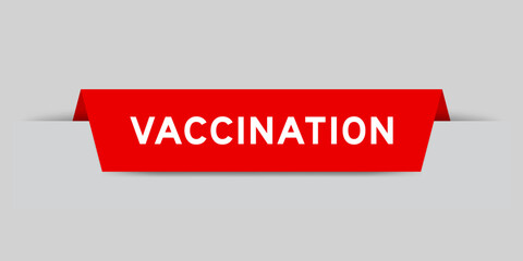 Red color inserted label with word vaccination on gray background