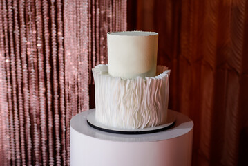 White wedding cake in reception.