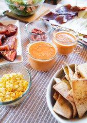 Spanish Salmorejo with Assorted Tapas on a Table