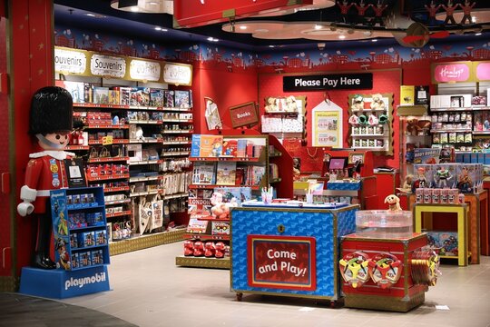 LUTON, UK - JULY 15, 2019: Hamleys toy store among duty free shops at London Luton Airport in the UK. It is UK's 5th busiest airport with 16.5 million annual passengers.