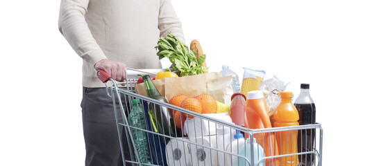 Man doing grocery shopping and pushing a trolley