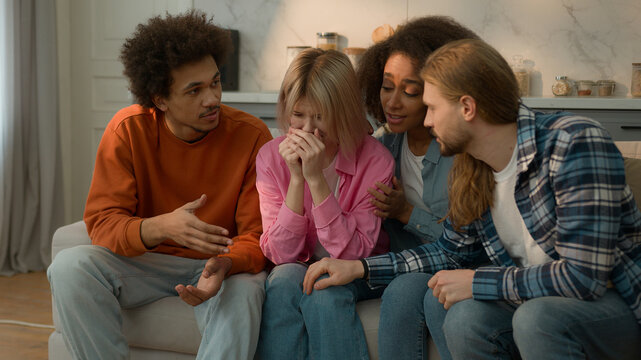 Sad upset crying suffering woman Caucasian girl female depressed breakup multiracial friends multiethnic diversity men women African guys girls females males at home support calming supporting help