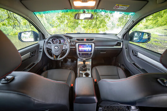 Moscow, Russia - June 2024: Blue pickup truck in the forest.  sollers st6 - Jac t6 - interior of SUV
