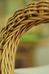 A closeup of the woven rattan texture of a chair